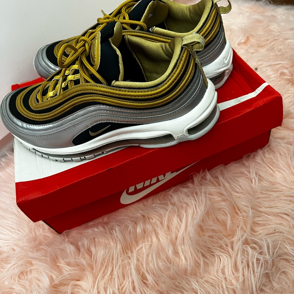 Gold and black sneakers